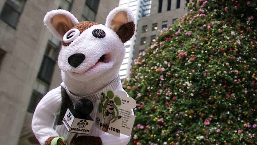 The Pets.com Sock Puppet makes an appearance near Jeff Koons' "Puppy" in Rockefeller Plaza