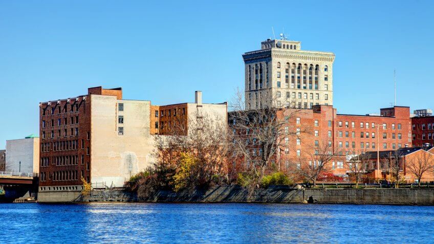 Saginaw Michigan skyline along the banks of the Saginaw River.