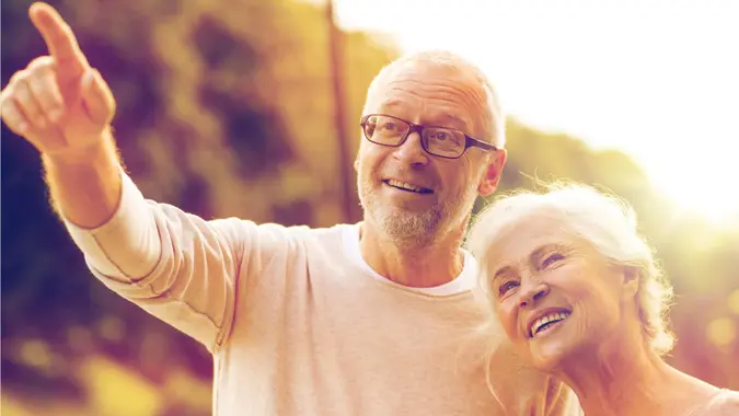 couple looking forward to the future and contemplating their retirement age and social security