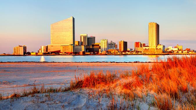 Atlantic City skyline hotel casinos from a scenic beach.
