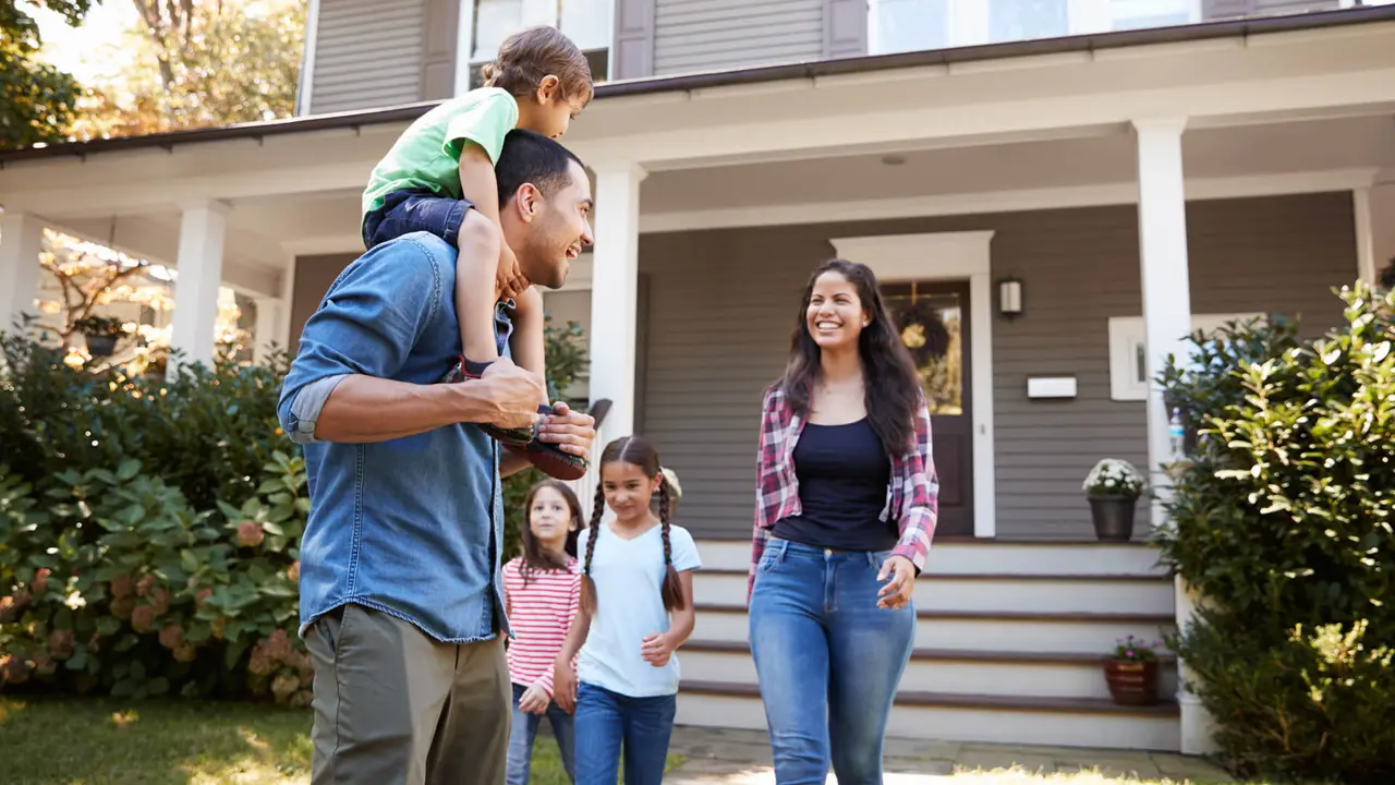 Father Gives Son Ride On Shoulders As Family Leave House.