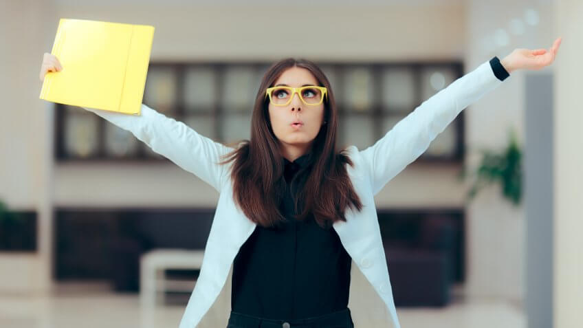Funny enthusiastic female executive celebrating professional achievement.
