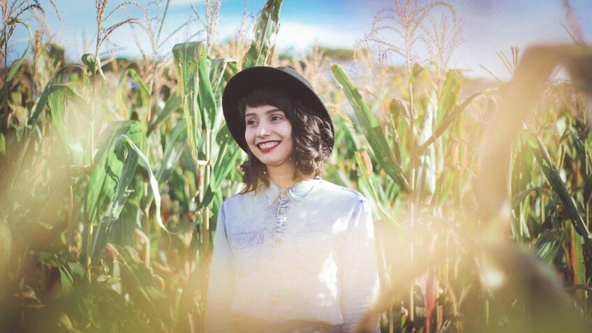 Hipster girl in the corn fields of Iowa