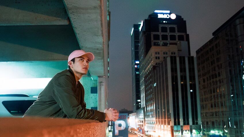 Man observing the city from the parking structure in Indiana