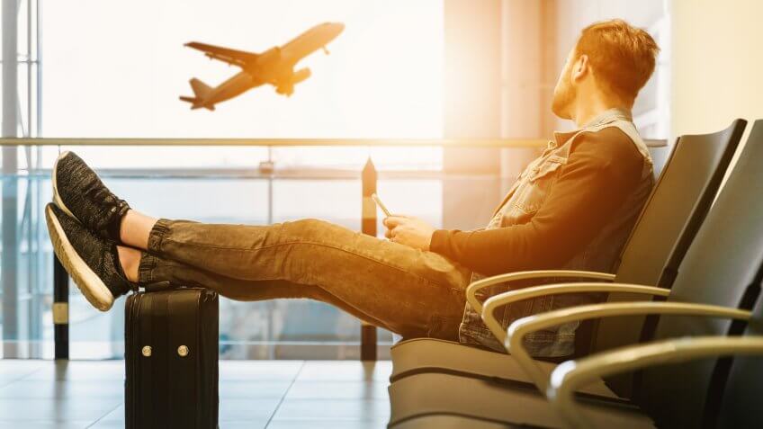 Man watching plane take off from the airport