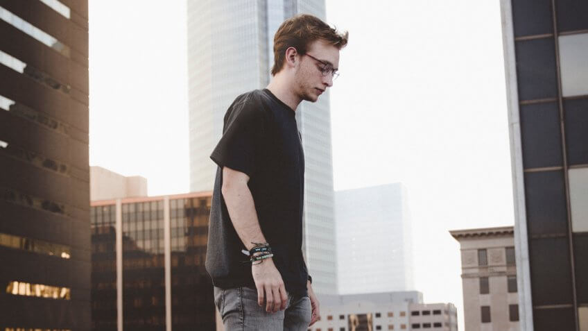 Millennial walking on rooftop in downtown Oklahoma