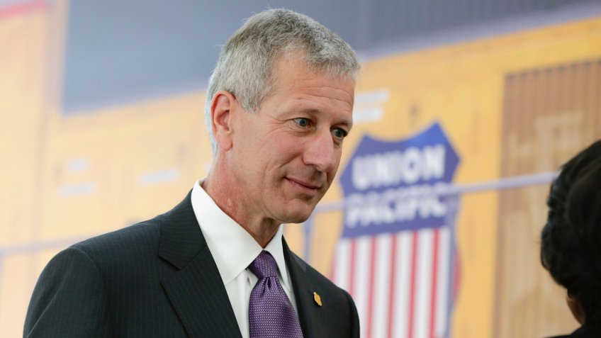 Photo by AP/REX/Shutterstock Union Pacific Chairman, President and CEO Lance Fritz, mingles with guests after a news conference at the Durham Museum in Omaha, Neb.