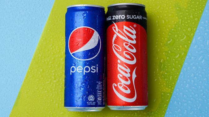 Pepsi and Coca-Cola on green and blue background