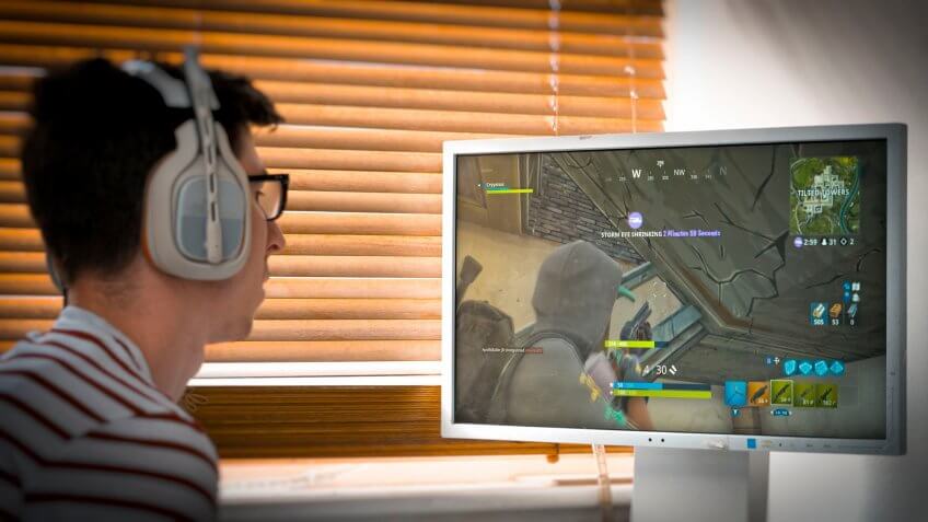 Mandatory Credit: Photo by Steve Meddle/REX/Shutterstock (9722617f)Teenager playing Fortnite video game, Fortnite is a web based multi player survival game developed by Epic Games.