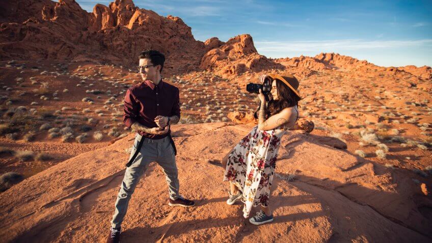 Tourists doing a photography shoot in the red rocks area of Nevada