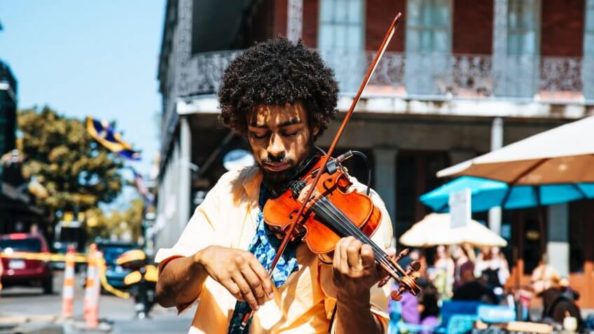 Violinist playing outside in public in Louisiana
