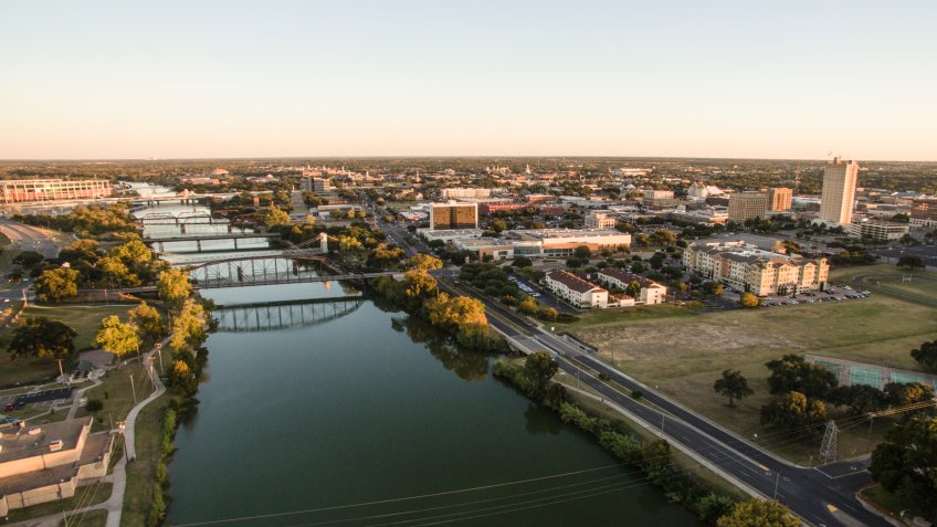Sunset come to Waco Texas and the downtown river front.
