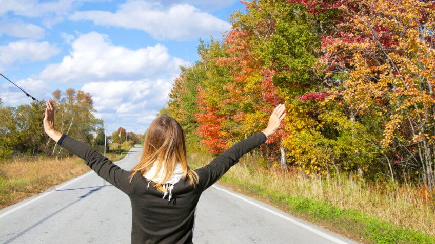 Woman enjoying fall foliage in Vermont