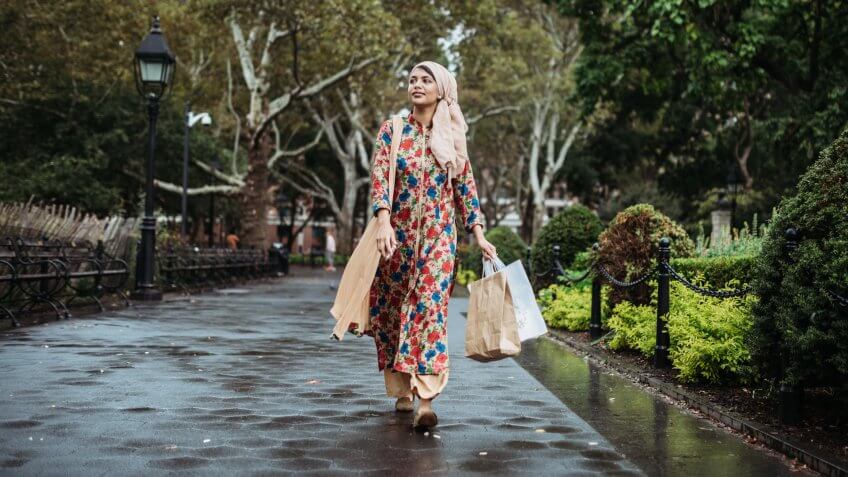 woman walking through park in NYC