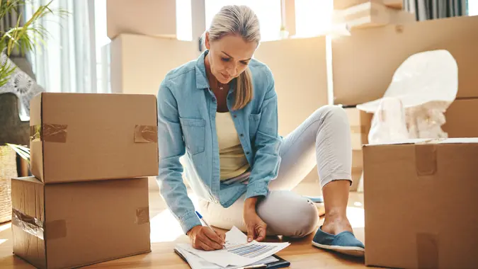 woman going through paperwork on moving day