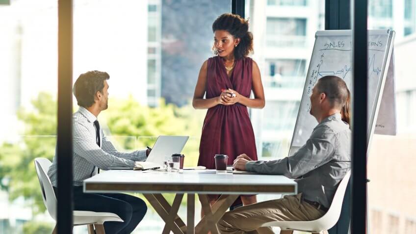 Shot of a group of colleagues having a meeting in a modern office.