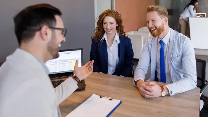 couple talking to loan officer
