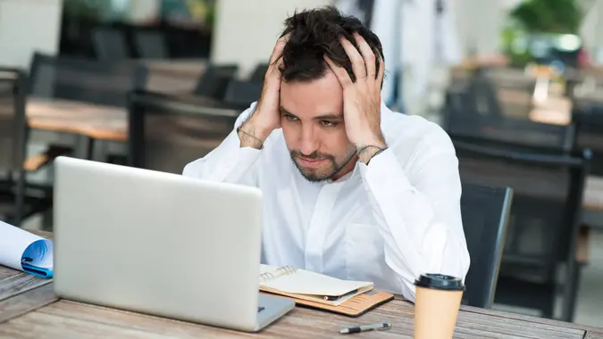 frustrated man with laptop