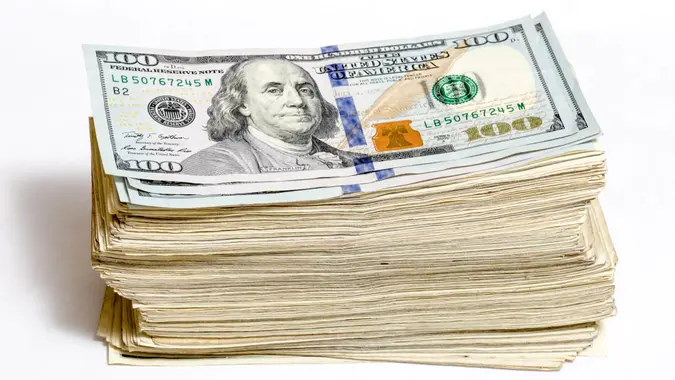 stack of one hundred dollar bills