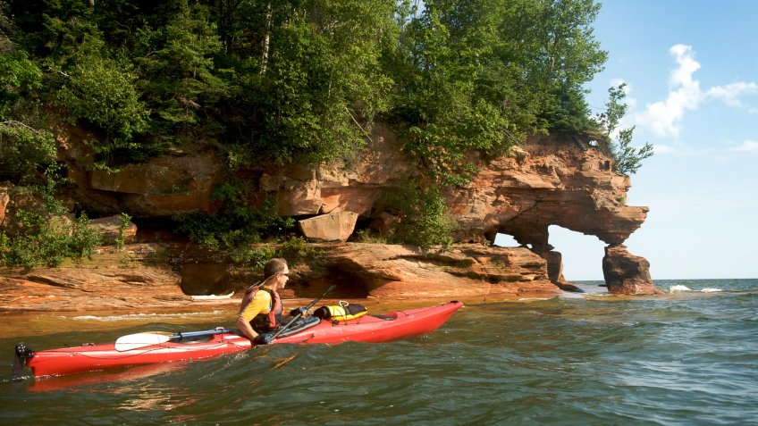 57-year-old man paddling a 16.