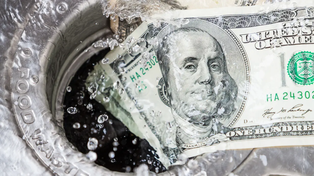 Money being washed down the drain