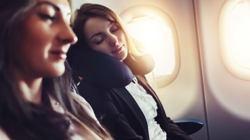 Girlfriends traveling by plane.