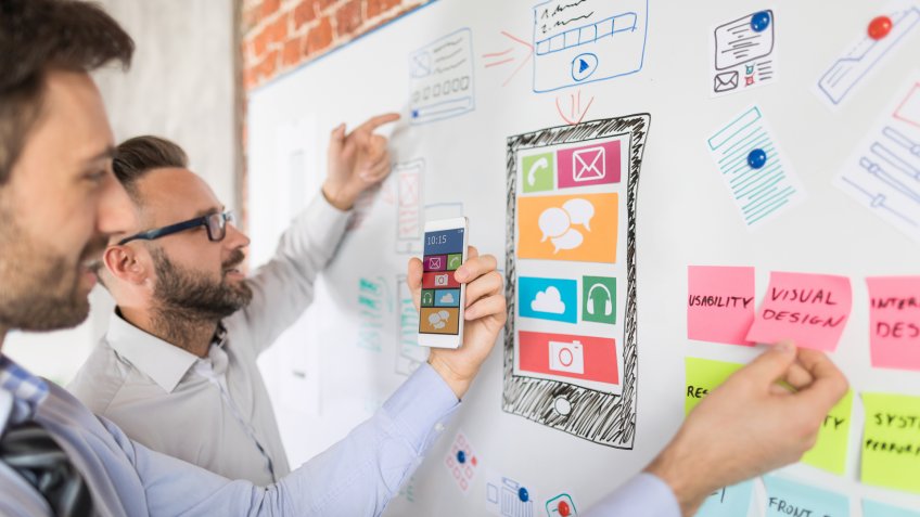 Designers man drawing website ux app development.