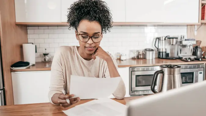 woman reviewing her paycheck and FICA tax