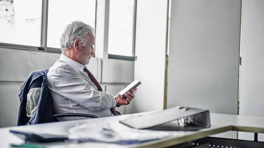 senior businessman working in office.