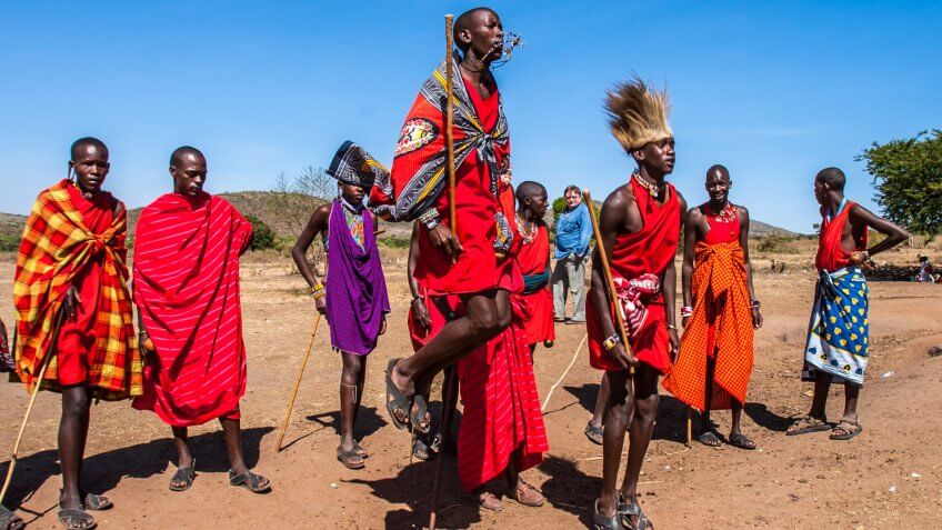 Residents of the Maasai Mara tribe dance the national dance