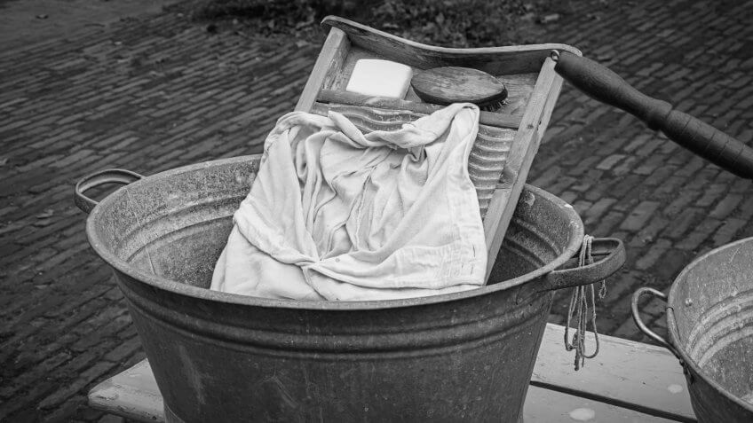 The attributes to do the laundry in an old fashioned way.