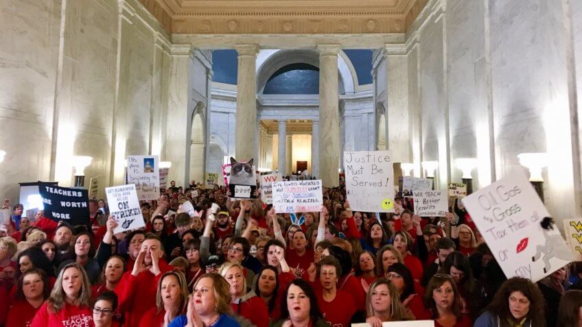 Mandatory Credit: Photo by John Raby/AP/REX/Shutterstock (9435169c)Thousands of teachers rally at the state Capitol in Charleston, W.