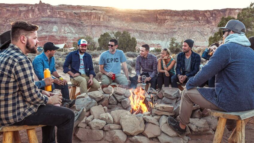 American friends sitting around a campfire