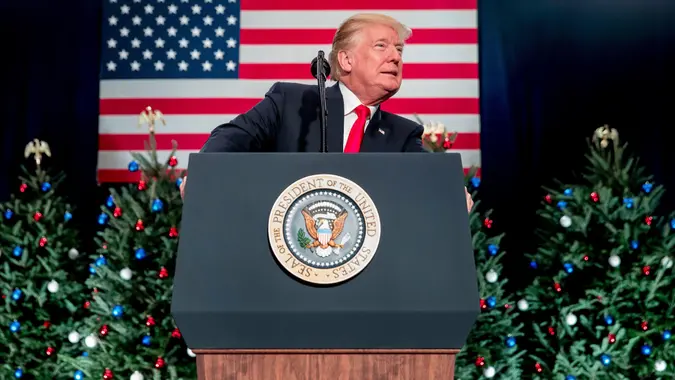 Mandatory Credit: Photo by Andrew Harnik/AP/REX/Shutterstock (9251873ae)Christmas trees are visible on stage behind President Donald Trump as he speaks at a tax reform rally at the St.