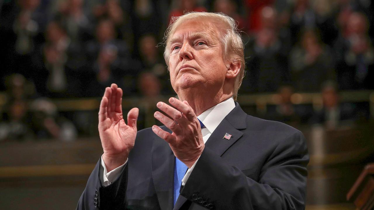 Photo by AP/REX/Shutterstock (9496974b)President Donald Trump claps during the State of the Union address in the House chamber of the U.