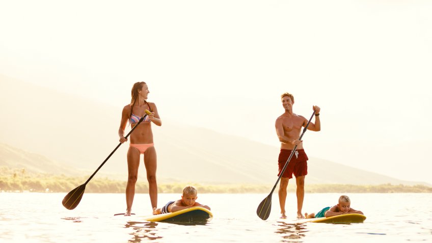 family paddle boarding in Hawaii