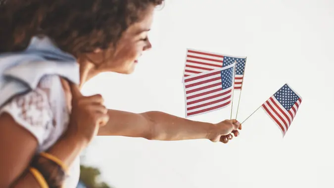 Beautiful girl is celebrating 4th of July.