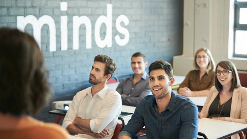 Shot of a group of businesspeople sitting in the boardroom during a presentation.