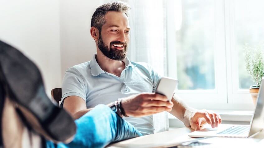 lucky bearded man makes business in the web at home.