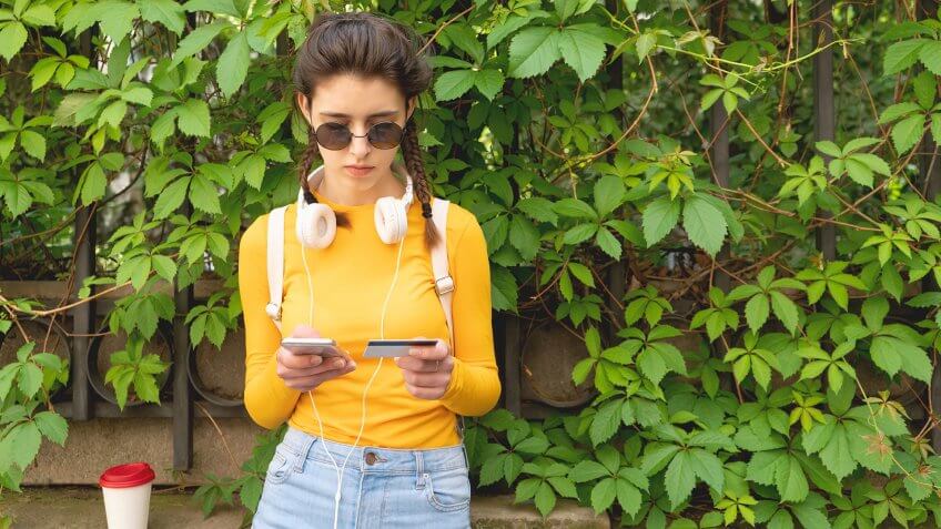 Girl buying online with credit card.