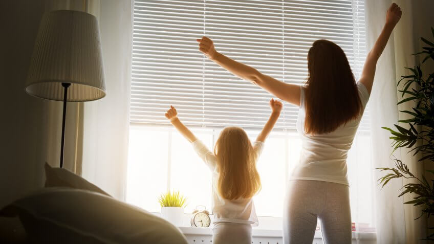mother and daughter enjoying sunny morning.