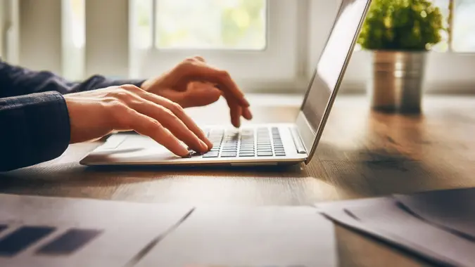 person typing on computer