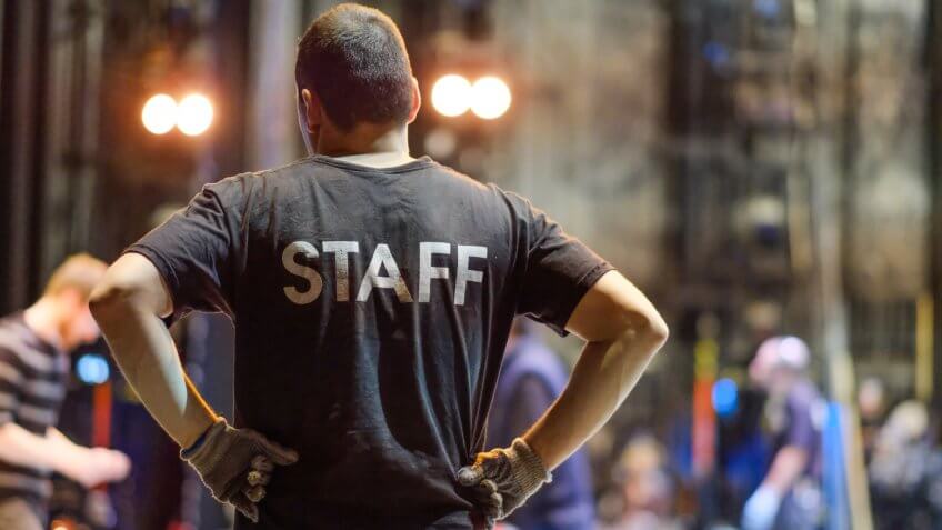 stage manager watching musical theater performers rehearse