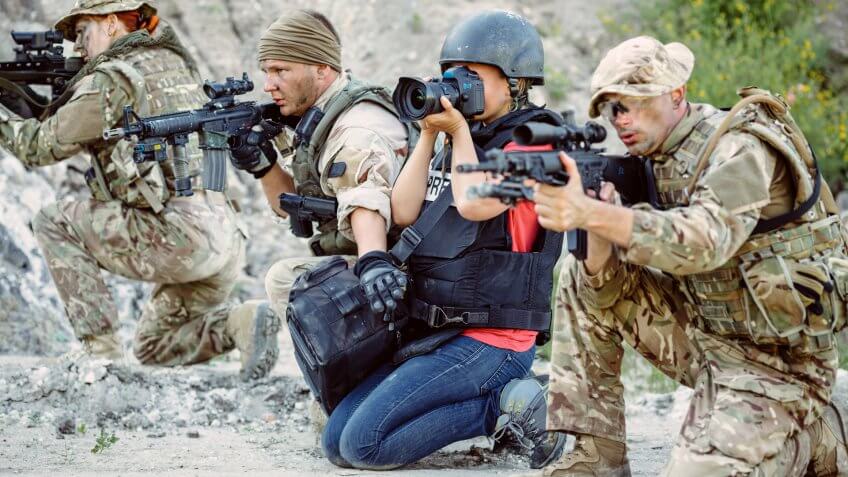 photojournalist among soldiers on the warfront