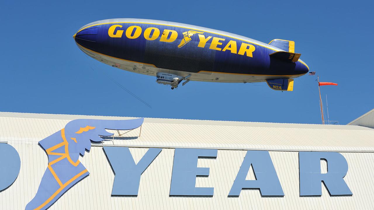 "Pompano Beach, Florida USA - February 8, 2011: The Goodyear Blimp is taking off from its home base at Pompano Beach airport in Florida, and is seen flying over its hanger.