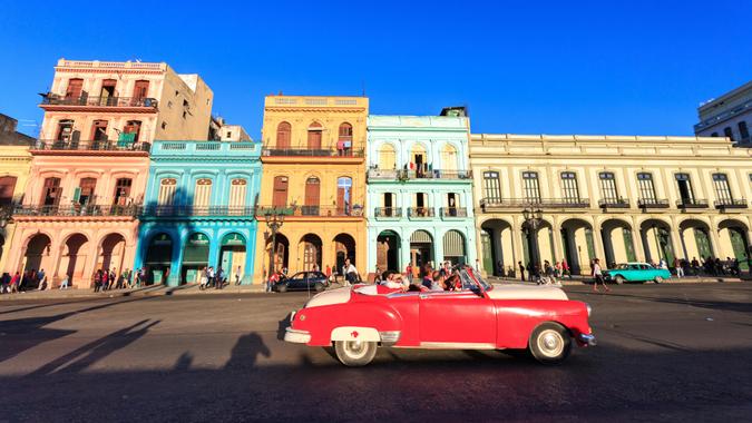 HAVANA - FEB 5: Classic red Car in Old Havana main street, on February 5th, 2015 Havana, Cuba.