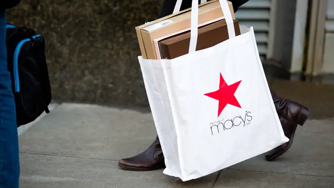 San Francisco, United States - January 5, 2017: A shopper leaves the Macy's flagship store at Union Square a day after it was announced they were closing stores and cutting jobs.