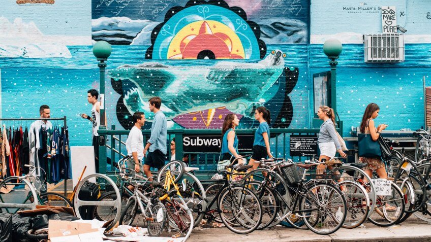 New York City, United States - August 30, 2015: People getting in and out of the subway in Williamsburg in Brooklyn.