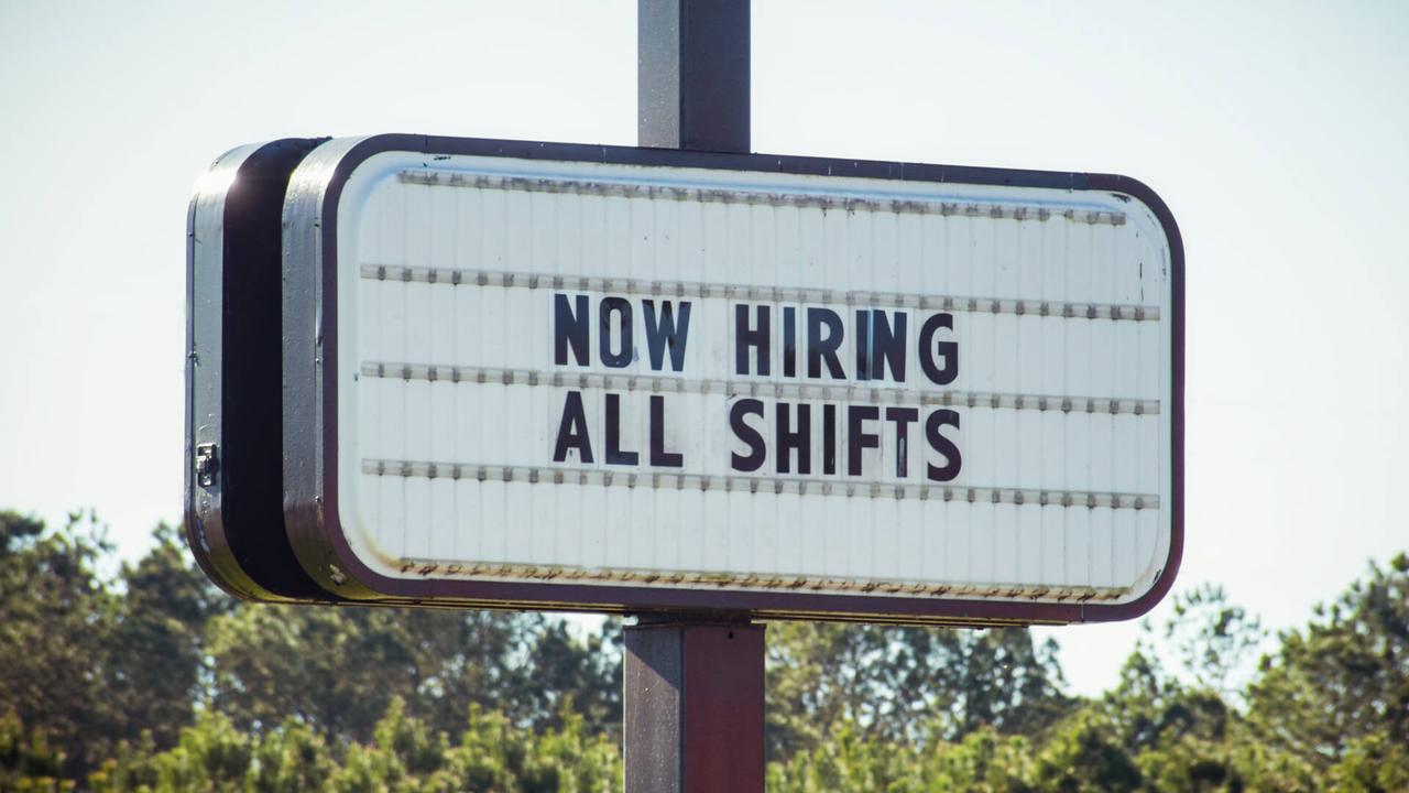 A business openly advertises work opportunities.