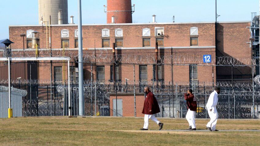 Mandatory Credit: Photo by Marc Levy/AP/REX/Shutterstock (7898351a)Inmates walk across a yard at the State Correctional Institution at Camp Hill, Pennsylvania, where a newly cleared wing is set to house inmates from other prisons that could close, in Camp Hill, PaPrison Pennsylvania, Camp Hill, USA - 13 Jan 2017.